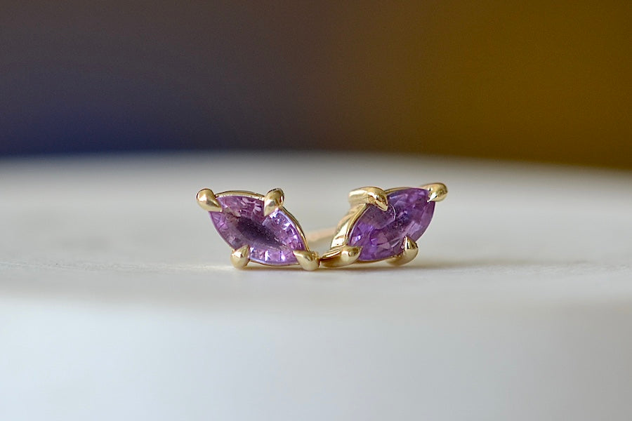 Eagle Claw Stud Earrings in Purple Sapphire by Elizabeth Street Jewelry are Marquise Sapphire Stud Earrings in violet purple to lilac that are bezel set marquise cut sapphires in a four prong eagle claw setting with post closure in 14k satin gold form these elegant everyday studs.