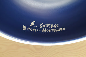 Signature on Blue vase.