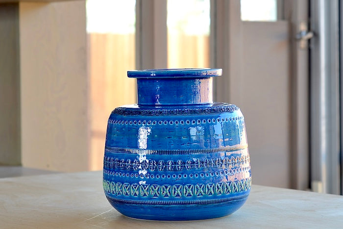 Rimini Blu Rochetto Vase is a ZZ999 Current production of the "Rimini Blu" series. Designed between 1955 and 1965 by by Aldo Londi. This vase is hand made in Italy and one of a kind, made in ceramic earthenware and with a blue glaze.