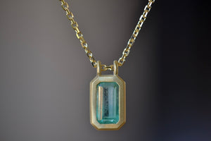 Close up of the The Duo Bale Emerald Pendant Necklace by Elizabeth Street Jewelry. Handmade in Los Angeles.
