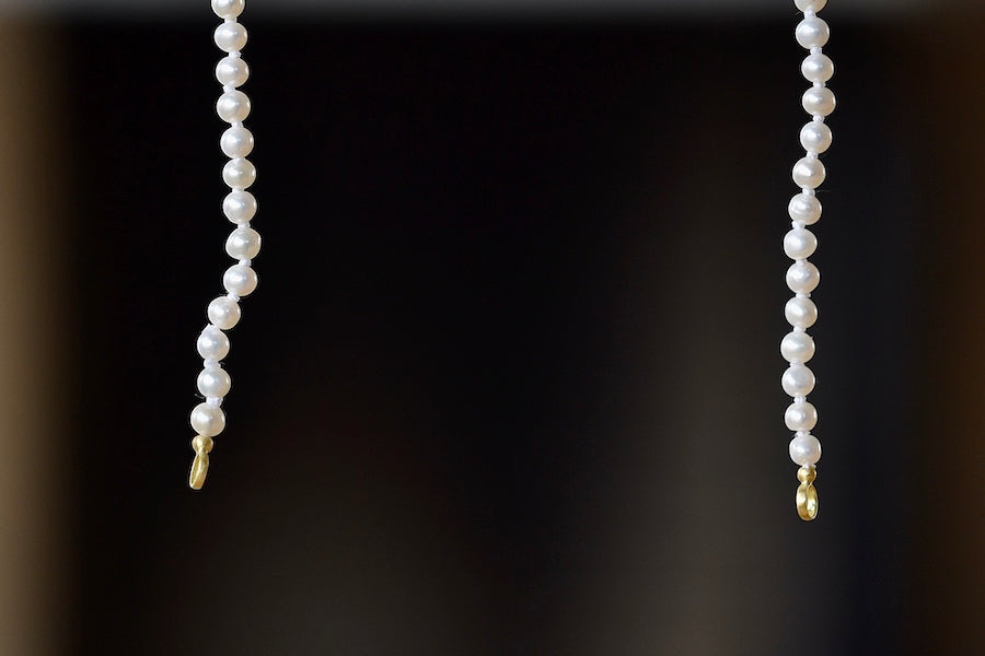 Alternate view of Small Seed Pearl Strand in White by Polly Wales is a A strand of a la carte fresh water seed pearls with gold bales on each end to fit a Polly padlock.