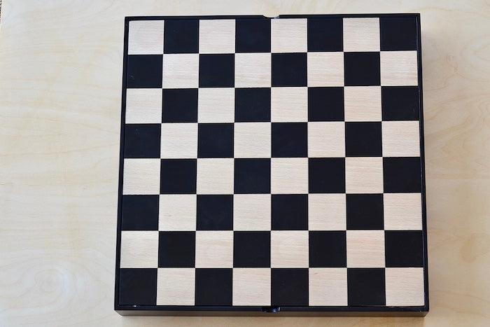 New Berliner Chess Set box with board on top.