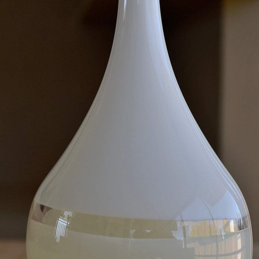 Close up of Lattimo White & Ivory Teardrop Vase Small designed by Caleb Siemon & Salazar, who trained with Pino Signoretto. Italian Milk glass.