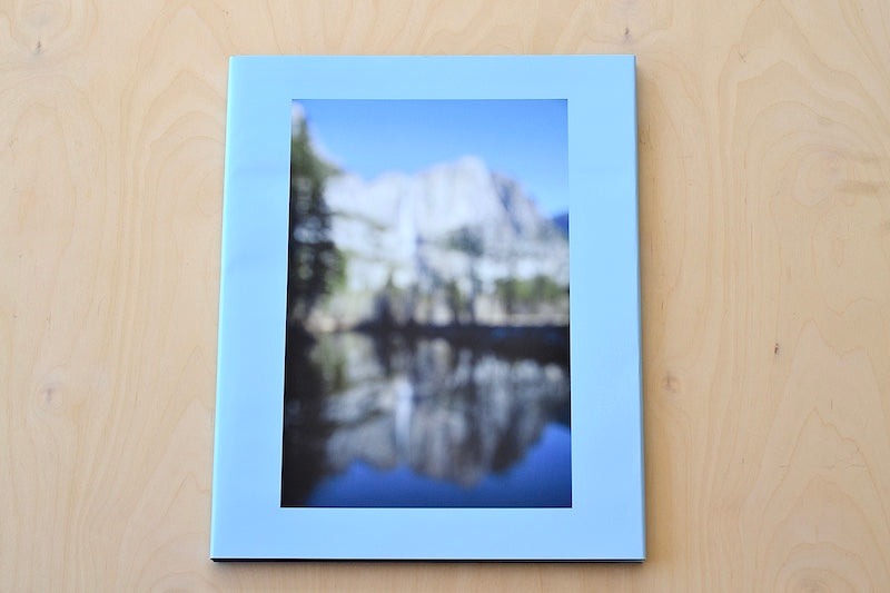 Yosemite by Catherine Opie is a slipcovered limited edition of 350  coffee table  book of photographs from Yosemite National park, in focus and out of blurred, capturing and breaking down its majestic nature from Nazraeli Press. 