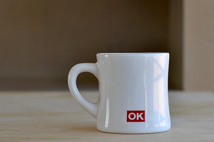 Alternate side of The OK mug is a large ceramic diner mug with "OK EVERYDAY" written on one side and our logo on the other. Los Angeles. Made in the USA.