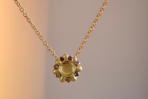 Polly Wales Small Sputnik Dome Pendant Necklace is a domed half sphere in 18k yellow gold with encrusted and inverted pink, blue and yellow sapphires around the circumference hangs on a beautiful chain. Cast Not Set. Recycled Gold.
