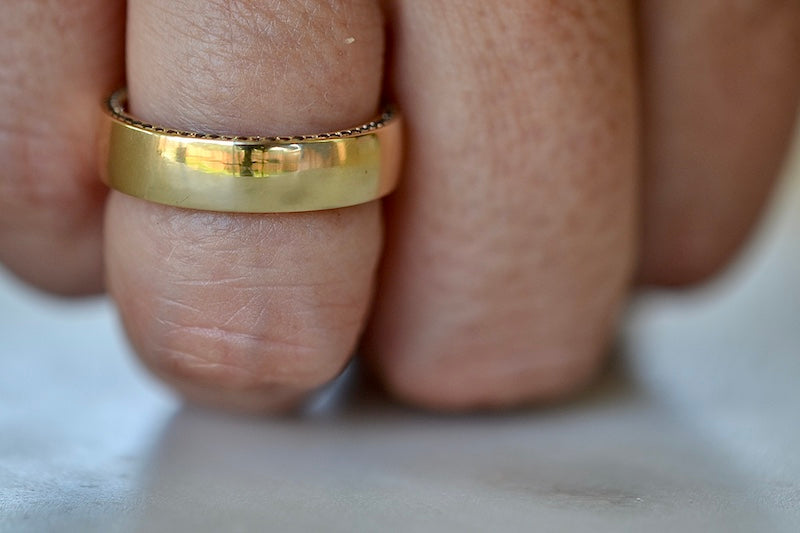 The Slim Pave Othello Cigar Band is a slim pavé 18k polished slightly rounded band by Lizzie Mandler with black diamonds on one side and white diamonds on the other. Handmade in Los Angeles.