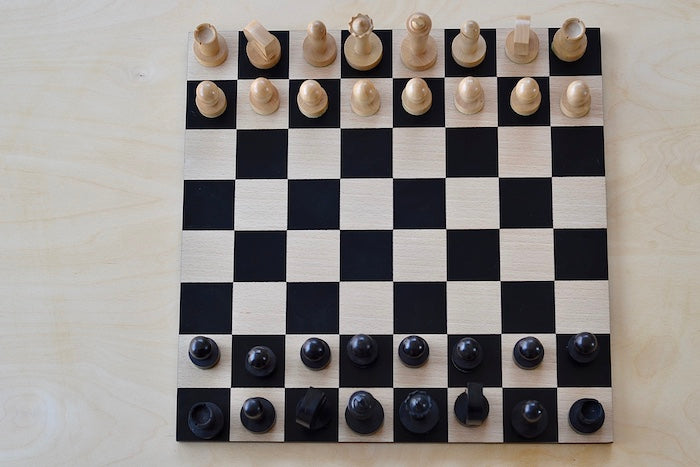 New Berliner Chess Set with pieces set our on board in birds eye view.
