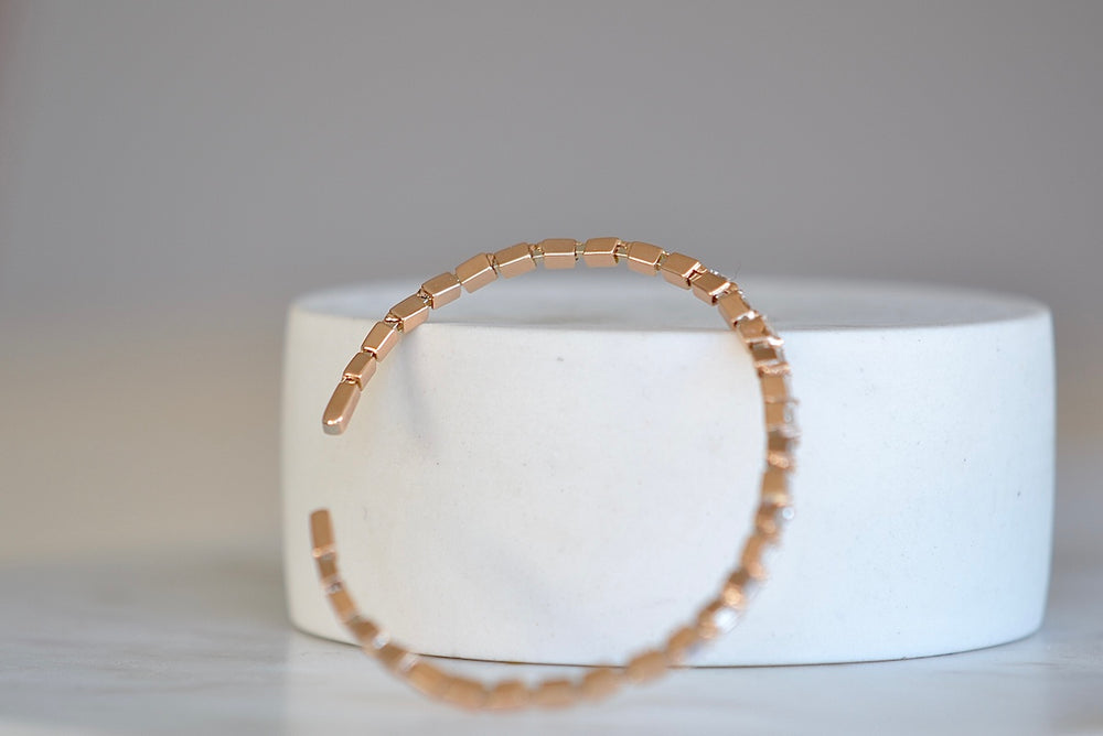Suzanne Kalan Zig Zag Flexible Diamond Baguette Bangle Shimmering and bezel set white baguette diamonds are mixed with solid gold shaped baguettes on a thin and flexible rose gold cuff in 18k rose gold.