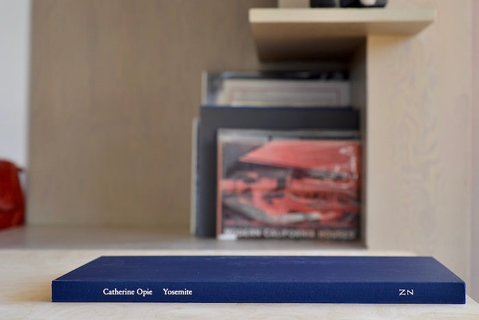 Yosemite by Catherine Opie is a slipcovered limited edition of 350  coffee table  book of photographs from Yosemite National park, in focus and out of blurred, capturing and breaking down its majestic nature from Nazraeli Press. 