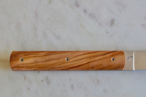 Detailed view of handle on 9.47 Steak Knife with Olive Wood Handle by Perceval.