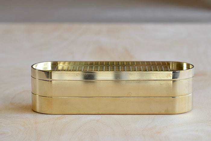 The 001 Stack Burner is a three tiered incense burner in polished brass. The top is a vent, the middle has space for up to three sticks to burn, and the bottom is extra storage. It is as posh as posh gets and we will include a box of our favorite incense. Designed by Populus Project in Canada.