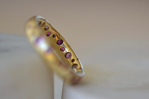 The inside of the Pink Sapphire Confetti Band Ring by Polly Wales in size 6. Cast not set. 