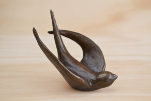 Bronze Object "Coming Home" (flying swallow) by Anne Ricketts.