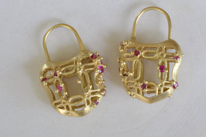 Polly Wales Coeur de Dentelle Padlock Earrings 18k yellow gold filagree padlock earrings with rich pink sapphires and a matte finish. Hinged ear wire closure