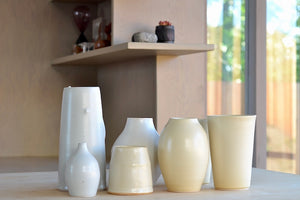 Seven white and cream vases by Hyejeong Kim. Stoneware vases made and hand thrown in Seoul, Korea.