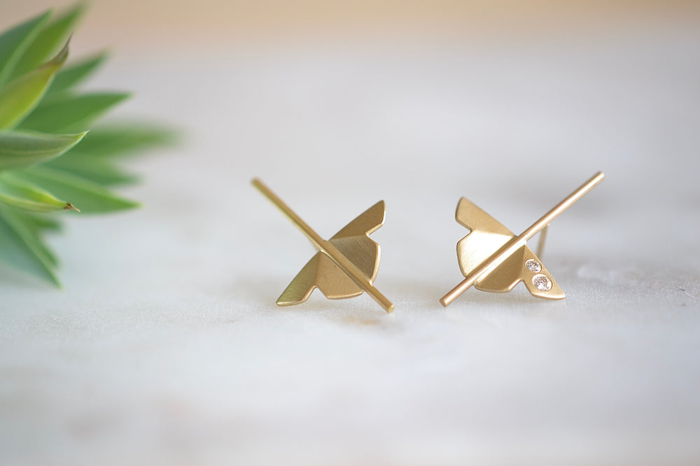 Kaylin Hertel single Lotus Stud earring in 14k yellow gold with two diamonds is made out of Abstract motif formed from creases of gold balanced on a stick.