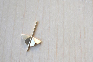 Kaylin Hertel single Lotus Stud earring in 14k yellow gold  is made out of Abstract motif formed from creases of gold balanced on a stick.