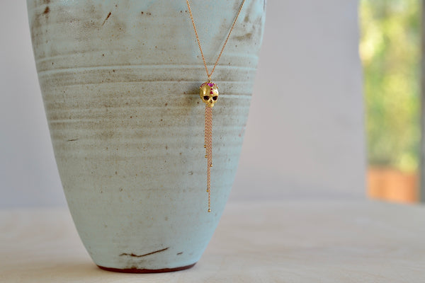 Polly Wales Forbidden Skull Necklace 18k yellow recycled gold pink fuchsia sapphires long chain necklace pendant enchanted.