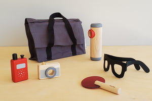 Detective kit set from Plan Toy with glasses, walkie talkie, camera, bag and accessories.