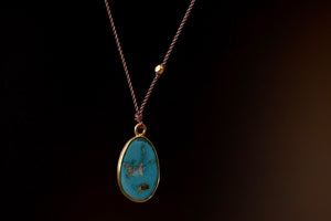 Sleeping Beauty Turquoise Pendant Necklace from the back by Margaret Solow.